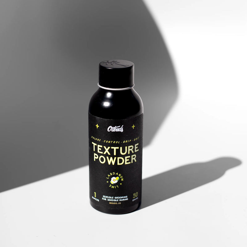 O'DOUDS polvos de peinado Texture Powder: bote negro frontal